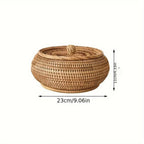 Round handcrafted natural rattan storage basket with a fitted lid and top knob for tea and snacks.