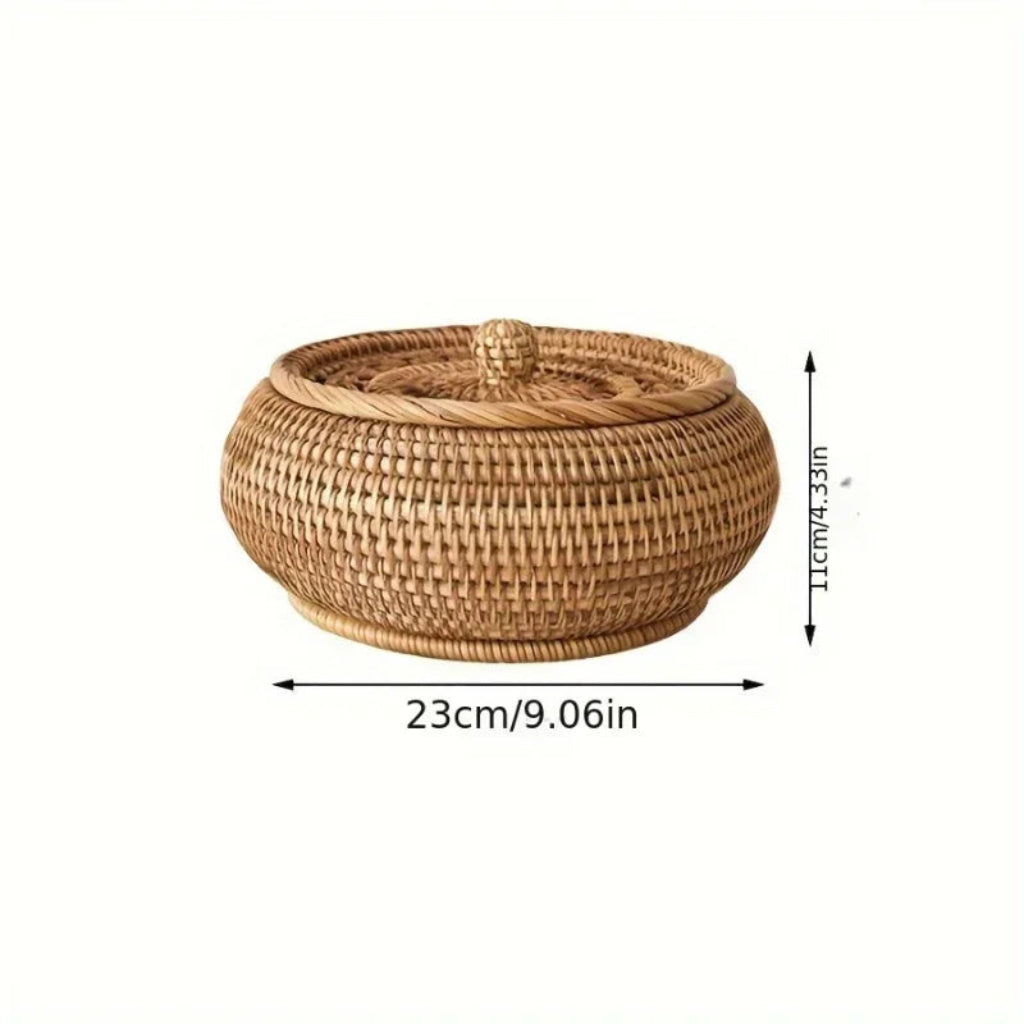 Round handcrafted natural rattan storage basket with a fitted lid and top knob for tea and snacks.