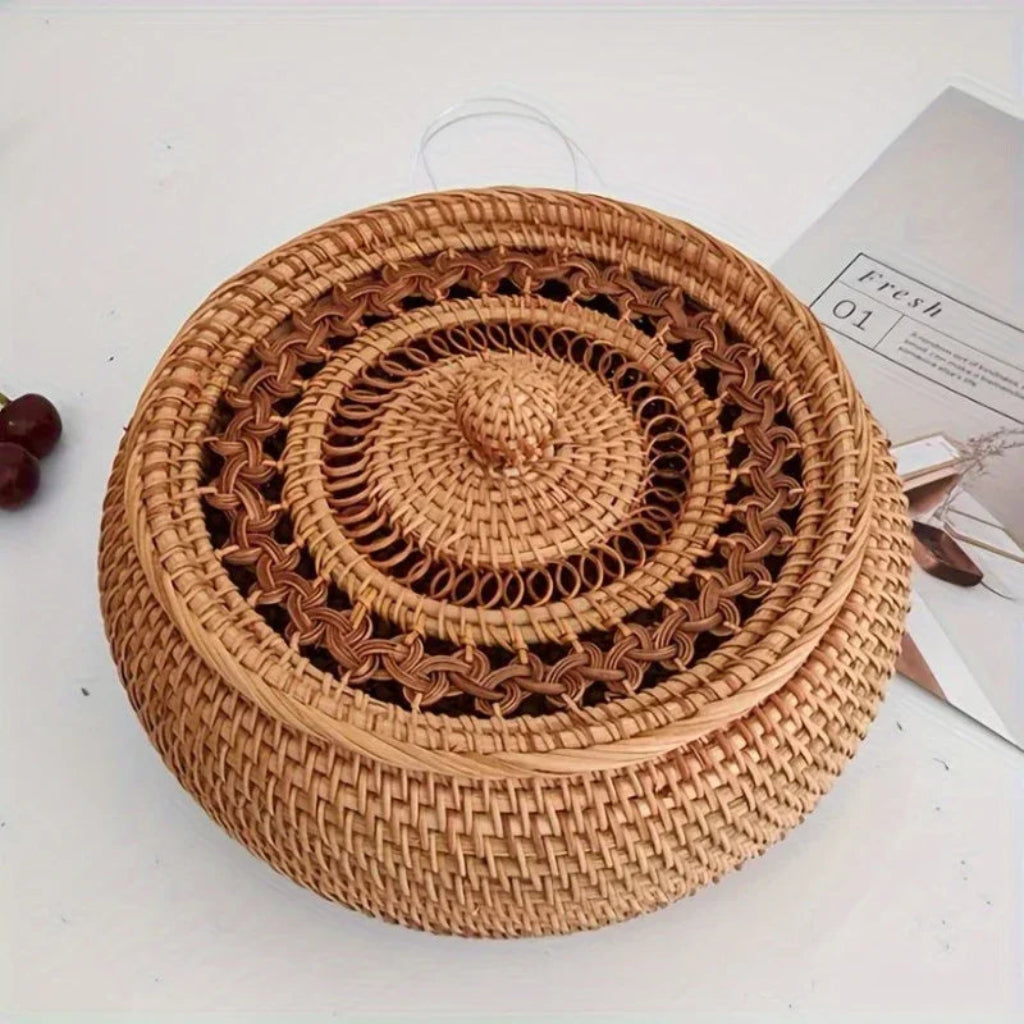Woven basket with a handle on a white surface