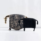 Elegant ceramic horse figurine featuring a black and gold textured bull design with a speckled pattern