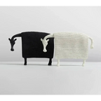 Black and white textured resin sheep figurines with stylized heads and legs alongside elegant ceramic horse figurine