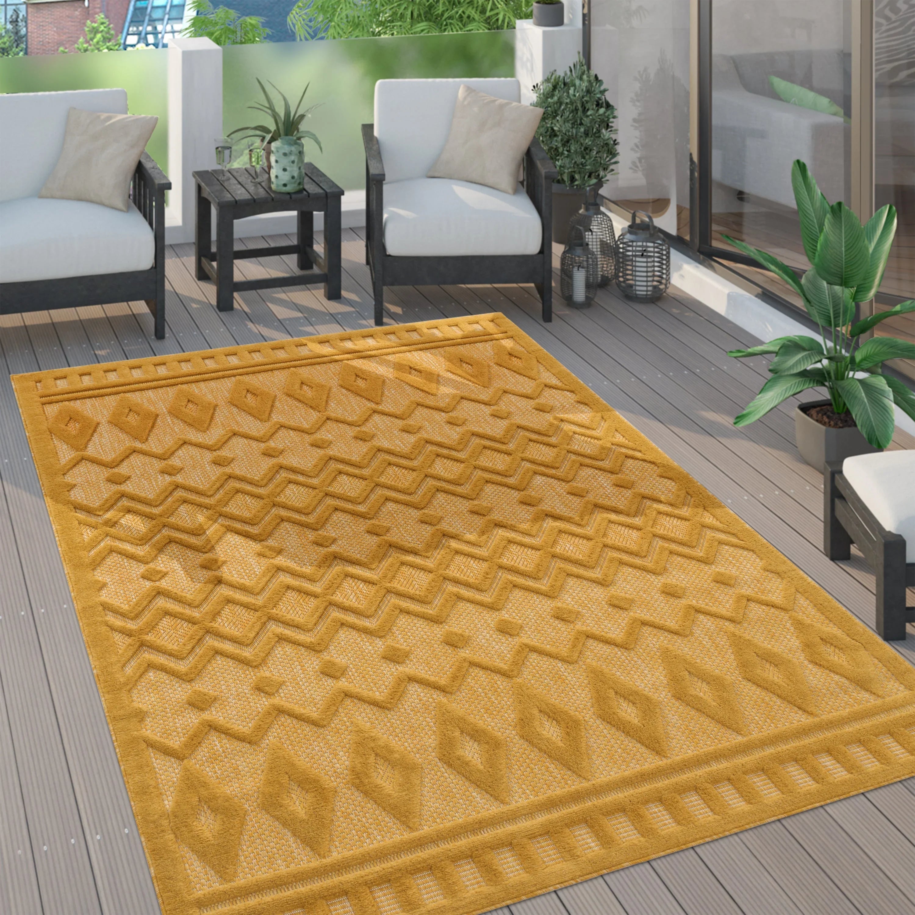 Yellow Livorno geometric trellis pattern indoor outdoor rug on a modern wooden deck.