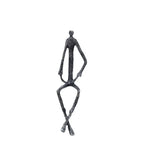 Large abstract sitting black metal sculpture of a stylized human figure with elongated limbs and textured surface