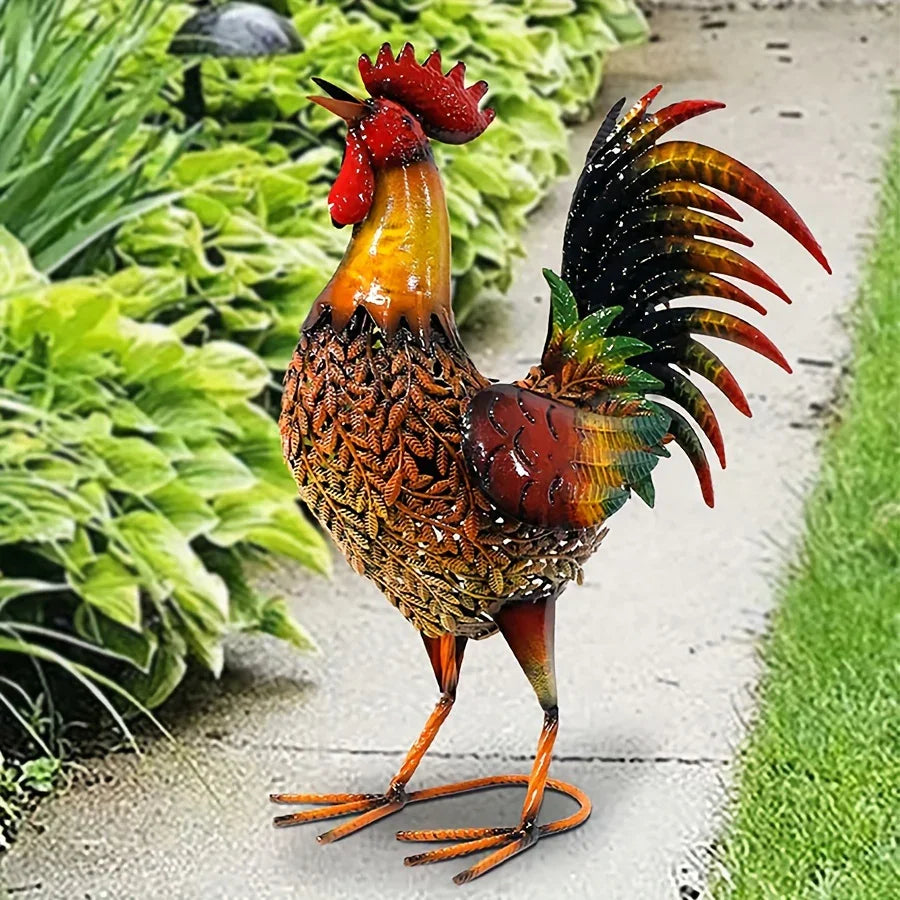 Colorful large rustic metal chicken garden stake with a red comb and patterned body in a lush garden setting.