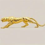 Golden running panther sculpture with textured spotted surface and sleek elongated form for modern home décor