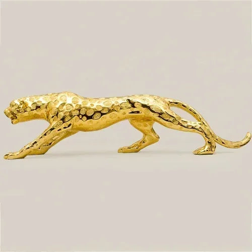 Golden running panther sculpture with textured spotted surface and sleek elongated form for modern home décor