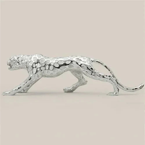 Silver metallic running panther sculpture with textured spotted pattern for modern home and office decor