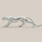 Silver metallic running panther sculpture with textured spotted pattern for modern home and office decor