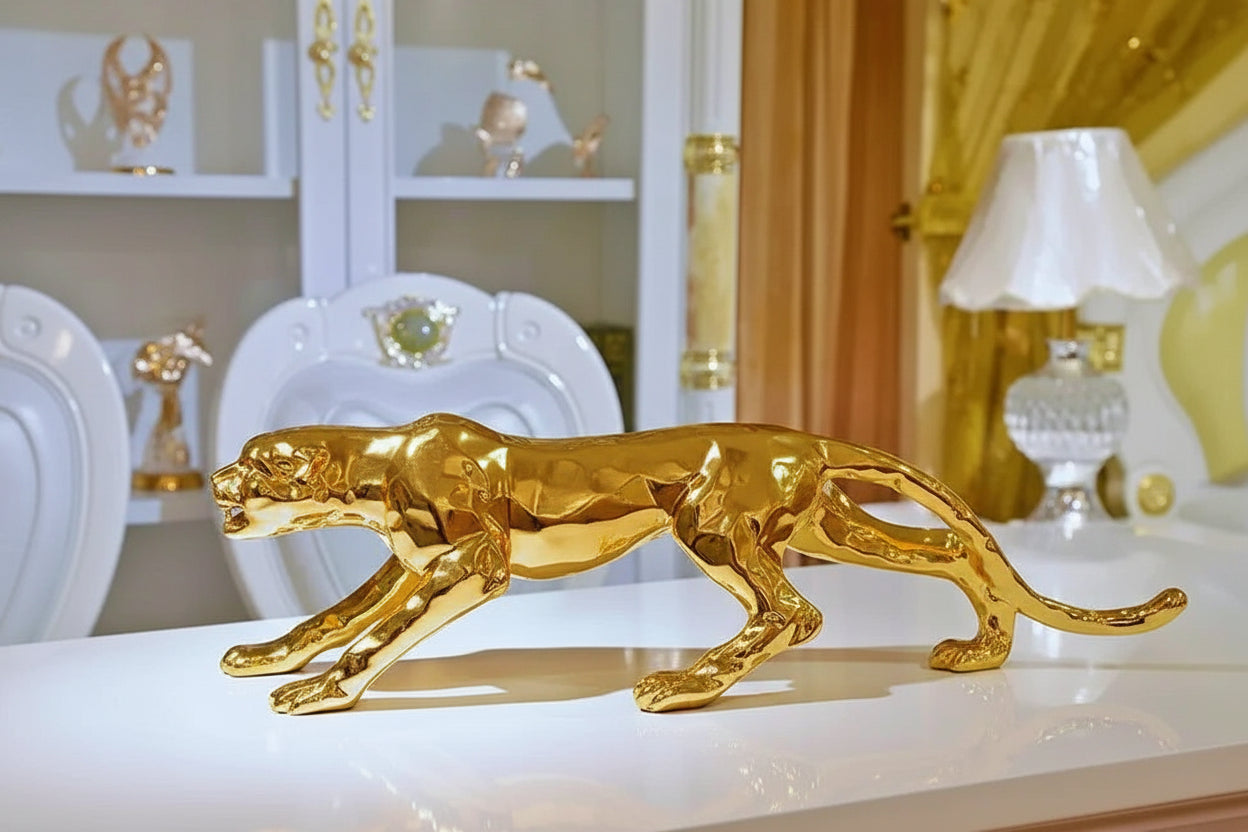 Luxury geometric running panther sculpture in golden metallic with sleek reflective surface for modern decor