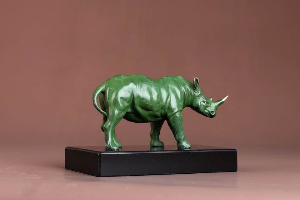 Luxury green rhinoceros statue decorative animal sculpture on a black base ideal for home and office decor