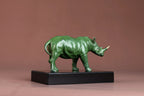 Luxury green rhinoceros statue decorative animal sculpture on a black base ideal for home and office decor
