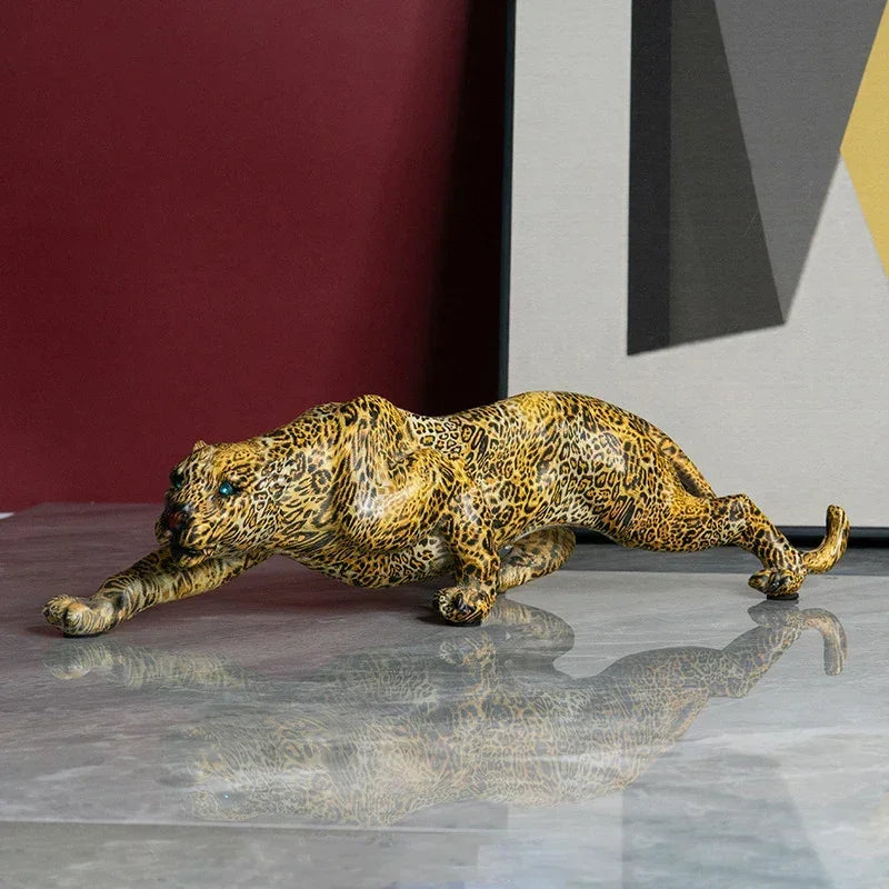 Luxury leopard animal figurine sculpture in glossy resin with intricate spots and teal eyes for modern home decor