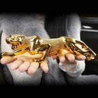 Luxury running leopard figurine with a textured metallic finish and detailed sculpting for home and office decor