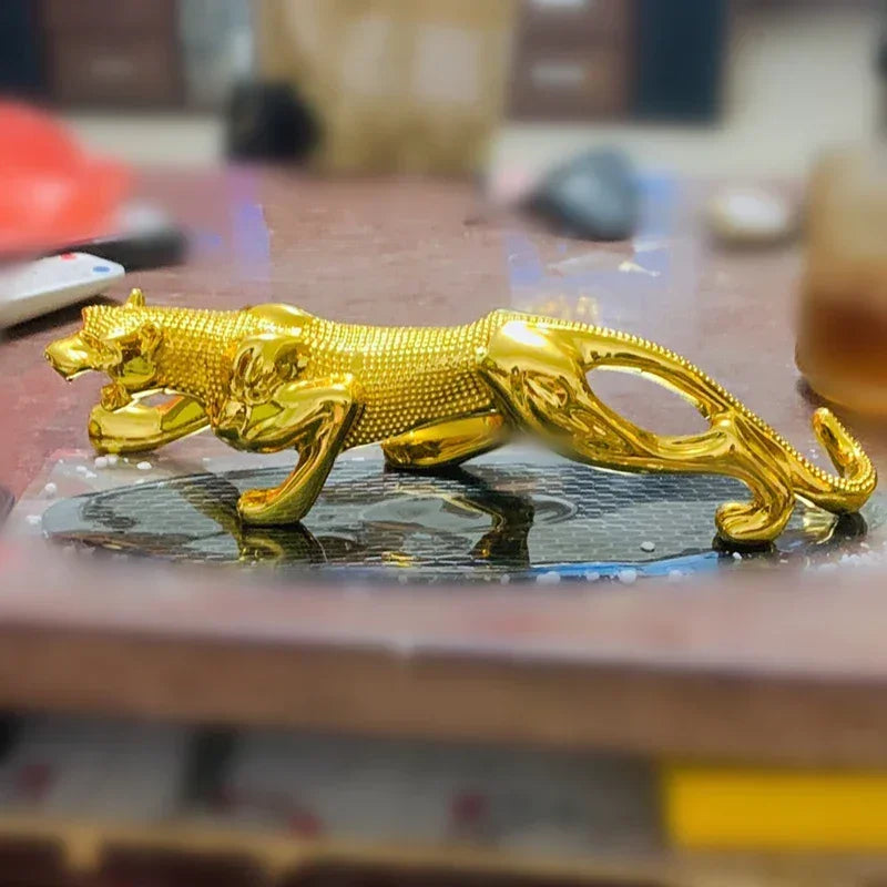 Luxury running leopard figurine in golden polished finish with intricate texture for home and office decor