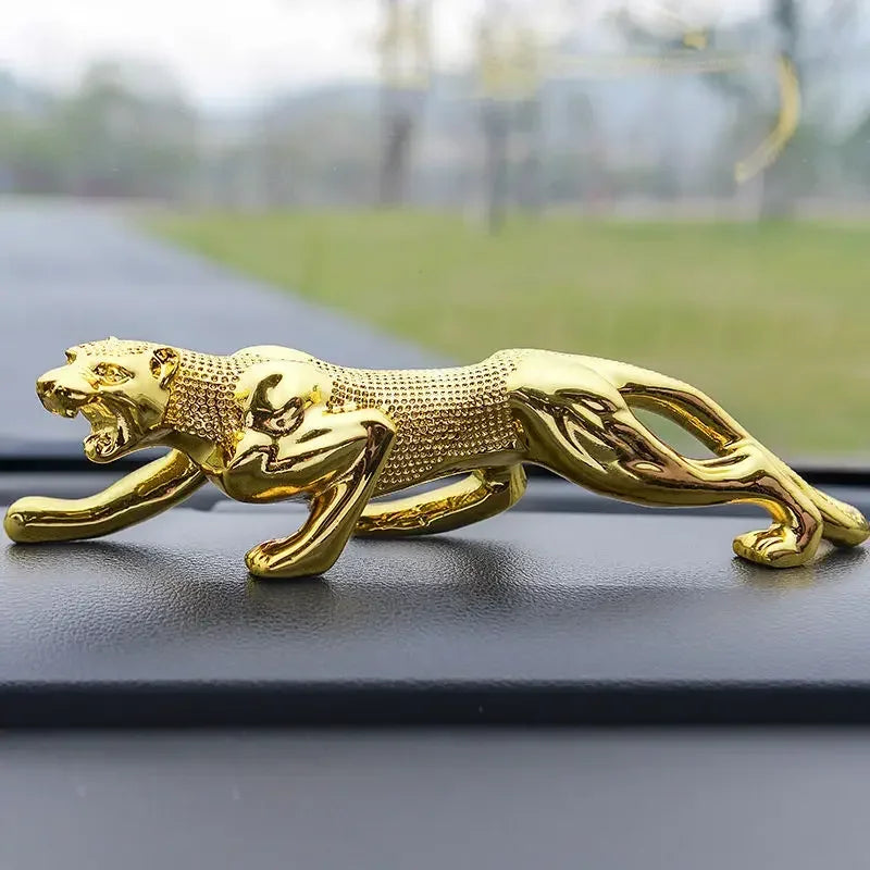 Golden metallic luxury running leopard figurine with detailed texture and sleek pose for car dashboard decor