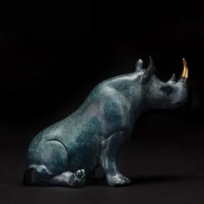 Luxury sitting rhinoceros animal figurine in bronze with gold horn and antique green patina decorative statue