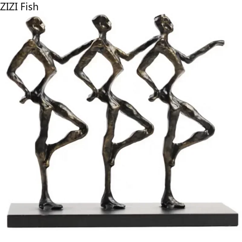 Bronze-colored metal sculpture of three stylized dancers on black base for unique metal desk decor