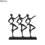 Black metallic metal sculpture of three abstract dancers in synchronized poses for a unique metal desk decor