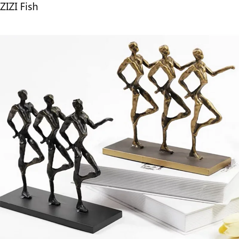 Set of two abstract bronze-colored metal sculpture dancer figurines on black and gold bases for a unique metal desk