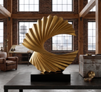 Gold wave sculpture styled on black coffee table | modern living room decor | House of Avana
