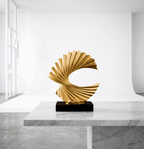 Gold wave sculpture styled on black coffee table | modern living room decor | House of Avana [[SKU:HOA-SCU-343]]