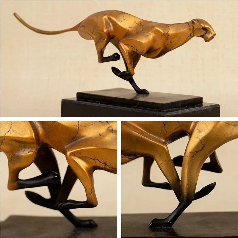 Modern running leopard sculpture features a golden metallic finish with black accents on a dark marble base for living rooms