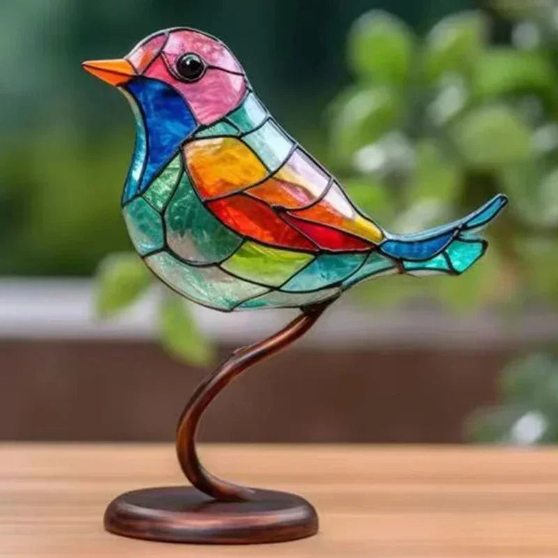 A vibrant multicolor acrylic bird with a comfortable color combination and elegant shape design on copper stand for desktop display