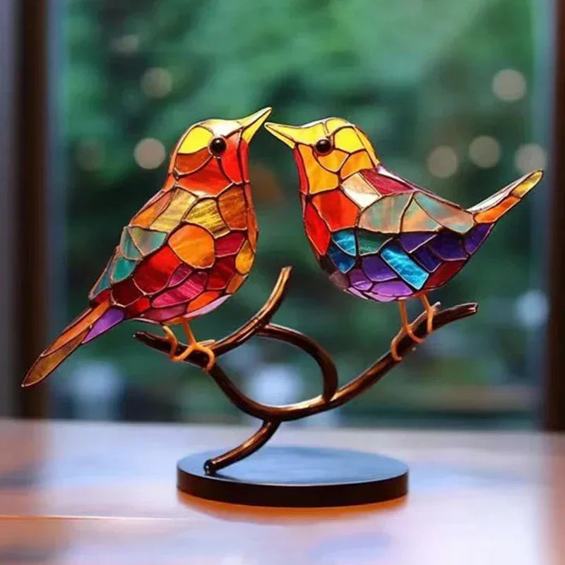 Multicolor stained acrylic birds with intricate mosaic patterns in a comfortable color combination on a bronze branch display