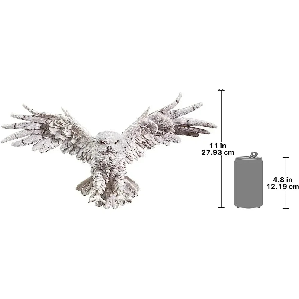 Detailed white owl sculpture with intricately carved feathers and outstretched wings made from decorative metal and high-quality materials