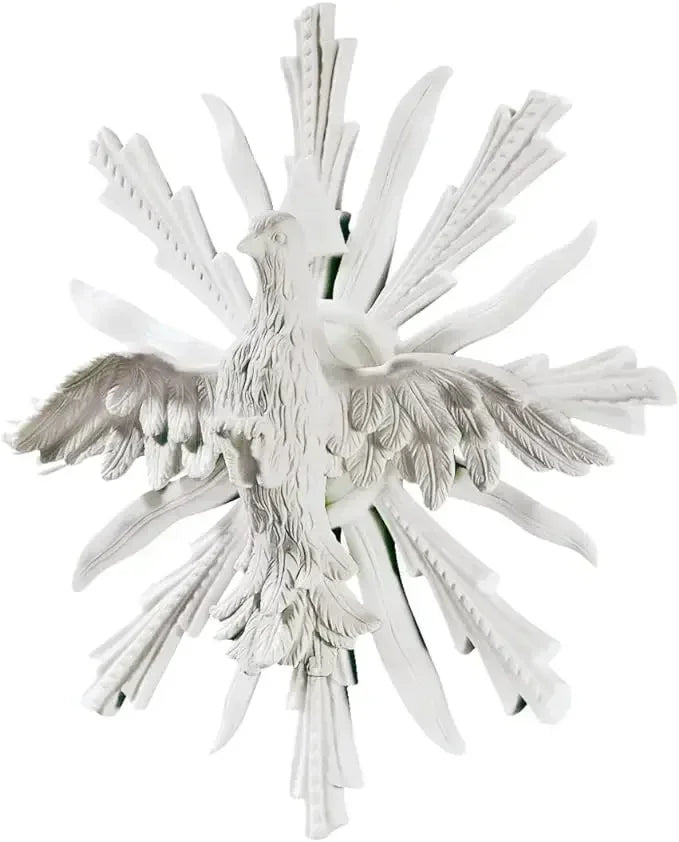 White resin dove ornament with detailed feathered wings and radiating leaf-like rays complementing decorative metal owl sculpture