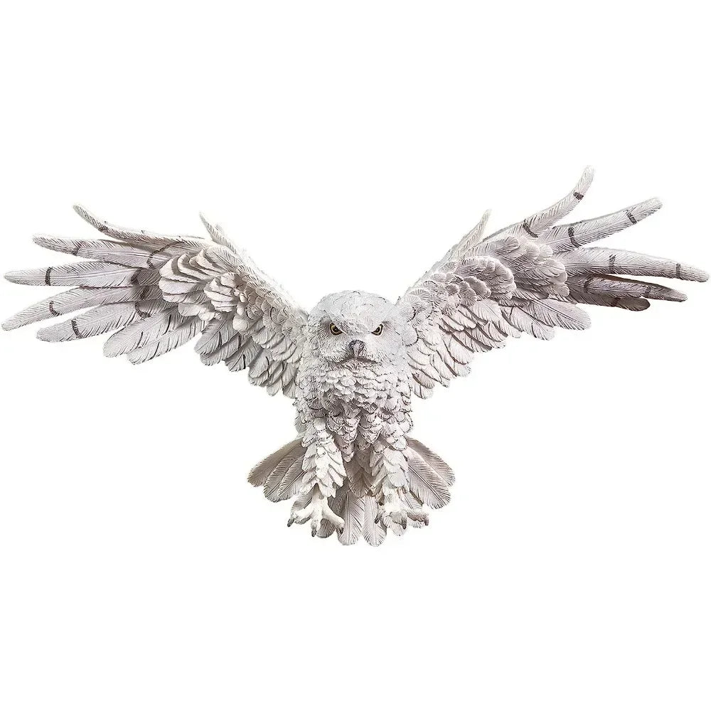 White owl sculpture with detailed feather texture and outstretched wings made of decorative metal and individually hand-painted
