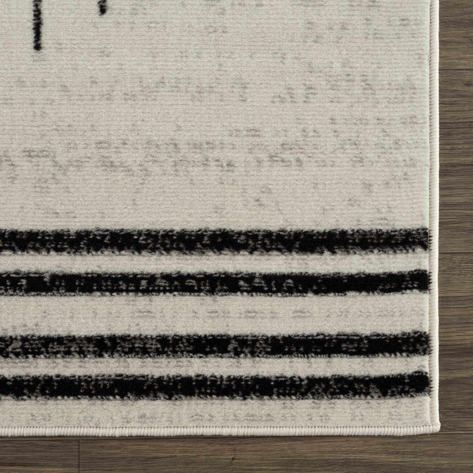Angus Abstract Black and White Area Rug Hauteloom