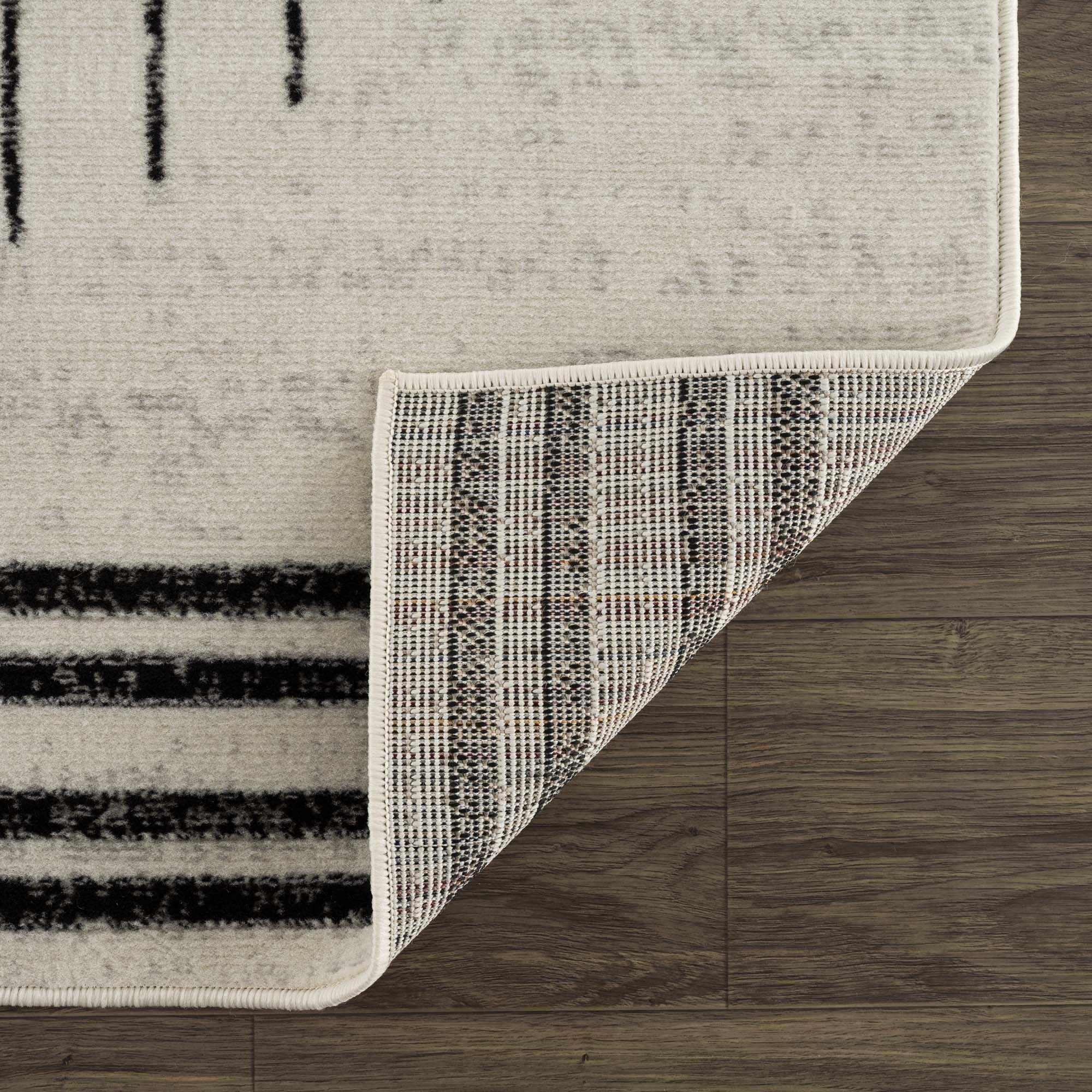 Angus Abstract Black and White Area Rug Hauteloom