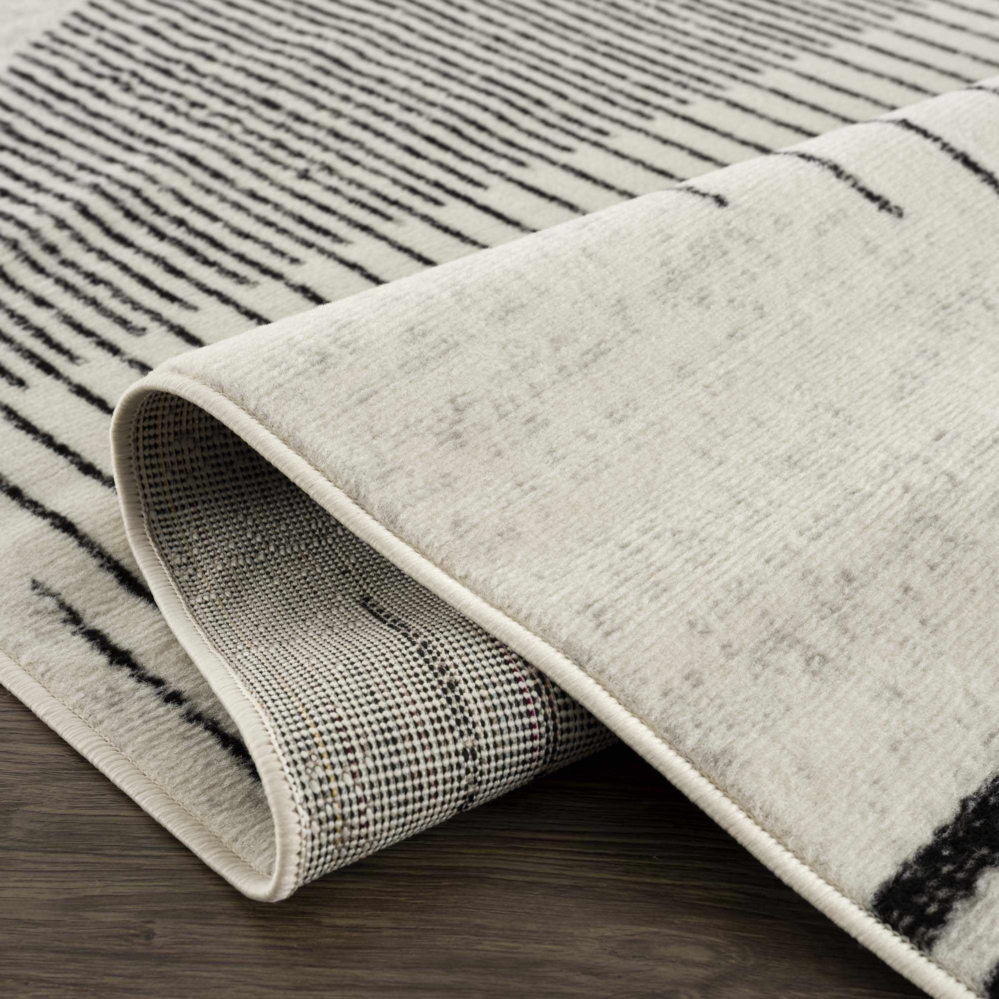 Angus Abstract Black and White Area Rug Hauteloom