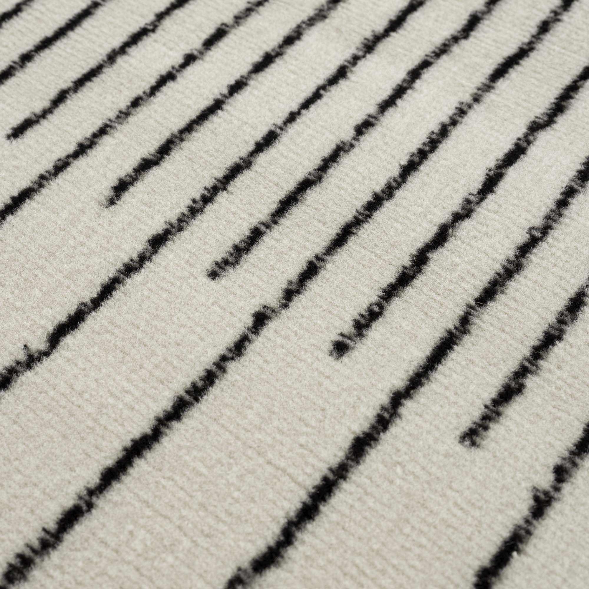 Angus Abstract Black and White Area Rug Hauteloom