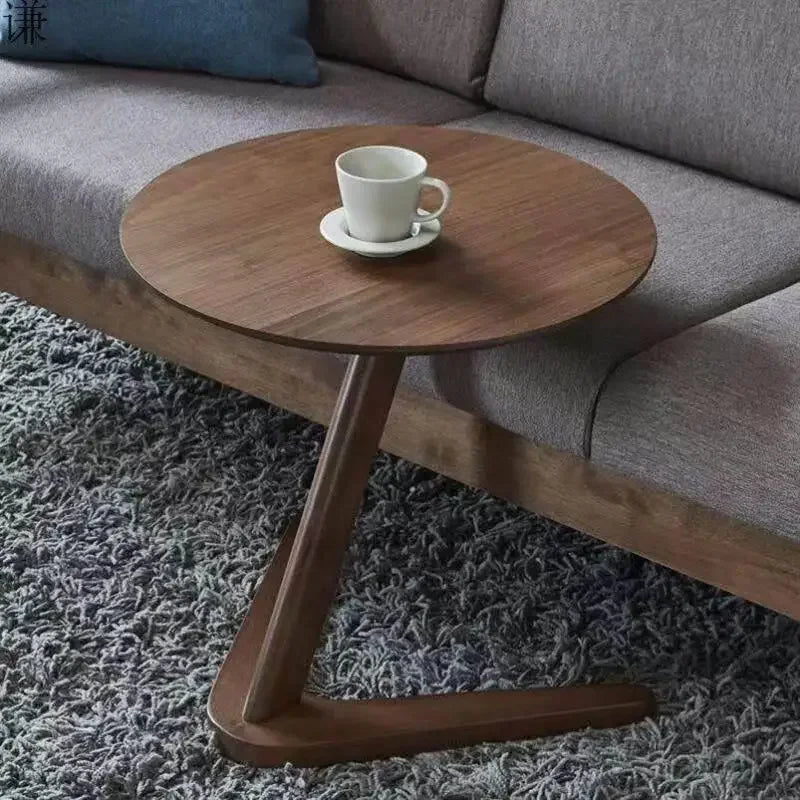 A sleek dark brown compact wooden side table with a modern z-shaped base ideal as a living room coffee table