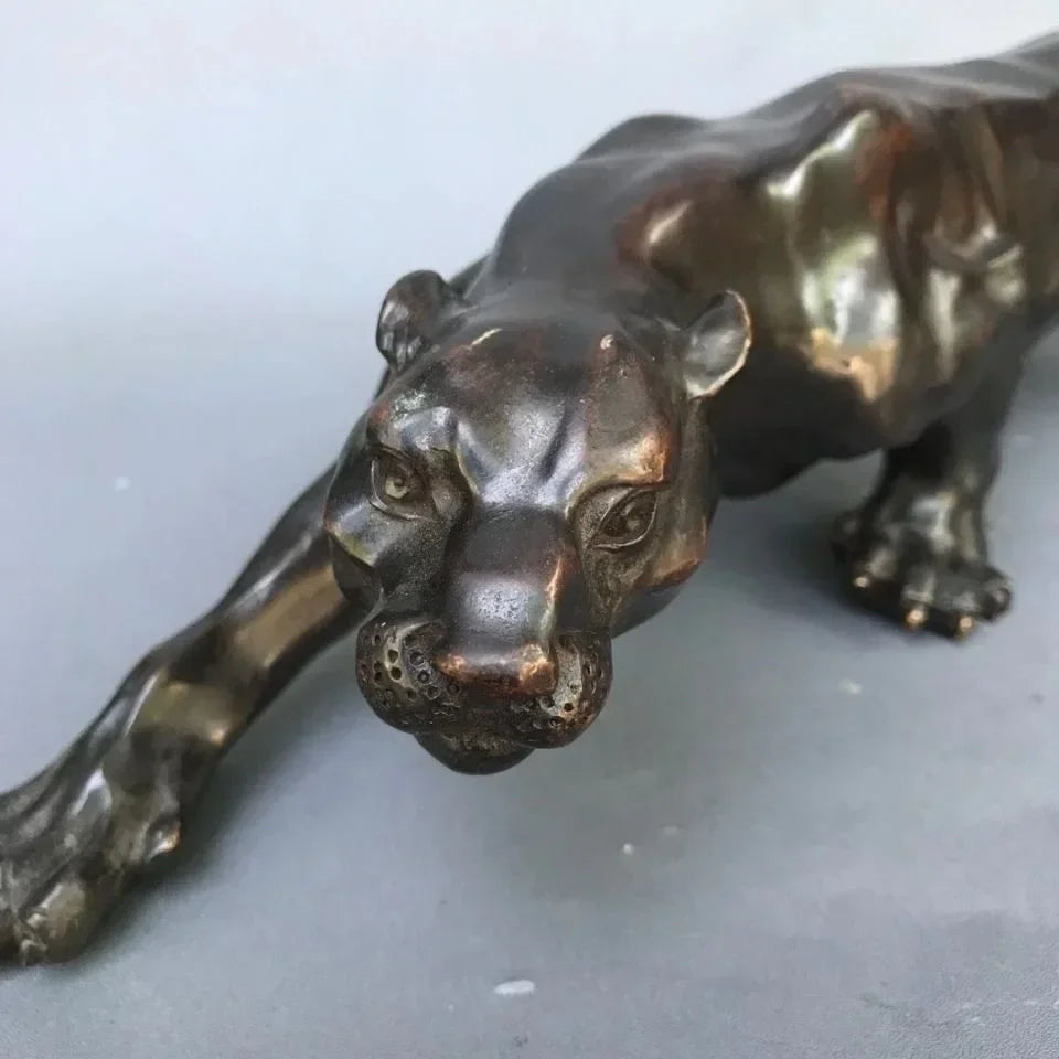 Bronze-colored running leopard bronze sculpture with detailed lifelike features and glossy finish for luxury decor