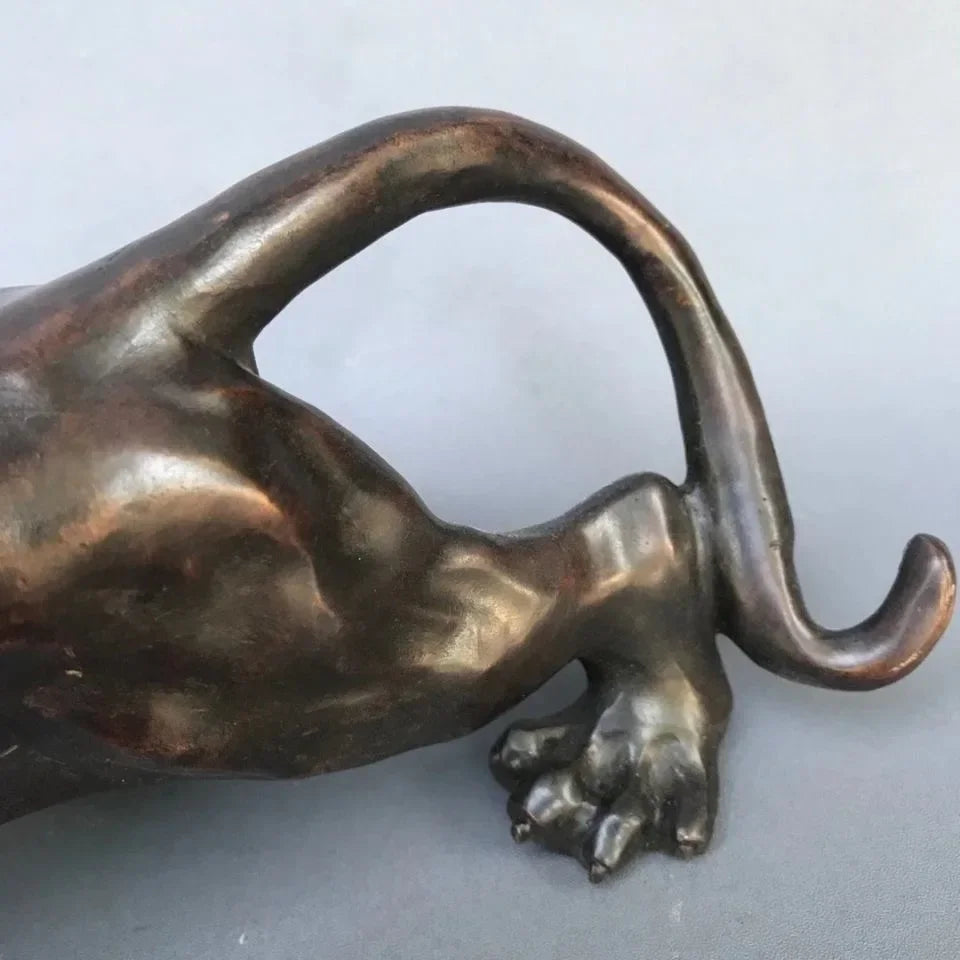 Bronze-colored running leopard bronze sculpture with sleek glossy finish and detailed paw for luxury home and office decor