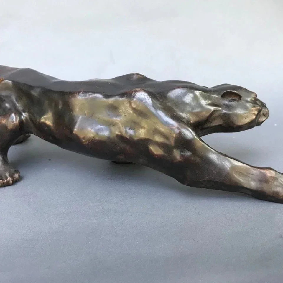 Bronze-colored running leopard bronze sculpture with sleek muscular form for luxury home and office decor
