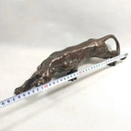 Bronze-colored running leopard sculpture with intricate details and sleek muscular design for luxury decor