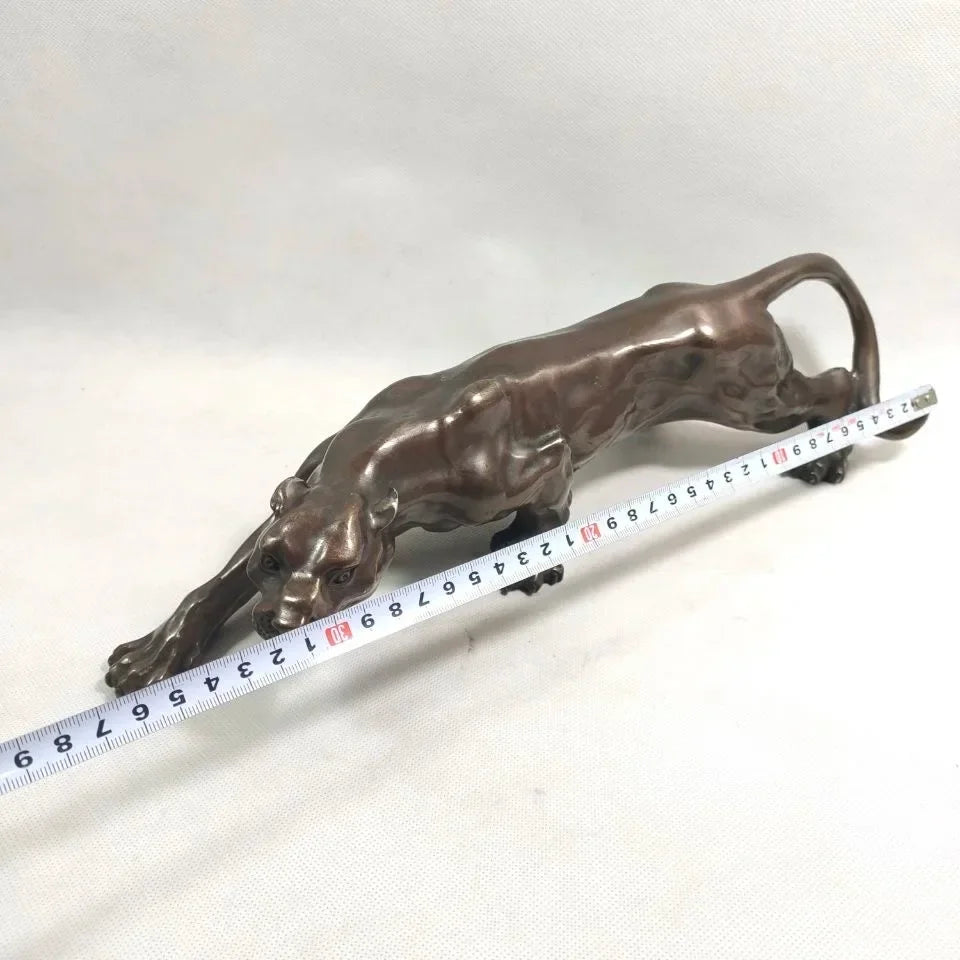 Bronze-colored running leopard sculpture with intricate details and sleek muscular design for luxury decor