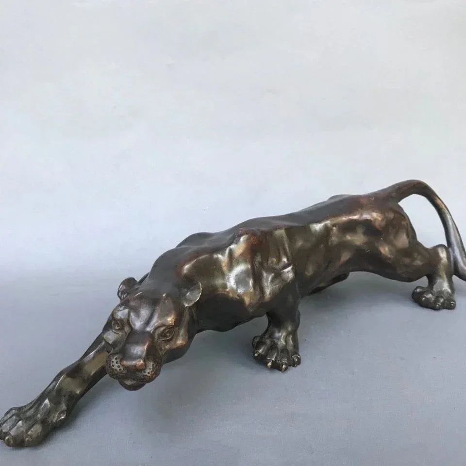 Bronze-colored running leopard bronze sculpture with detailed musculature and textured surface for luxury decor