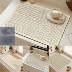 Beige placemats with line patterns on a kitchen counter, showing their effectiveness in absorbing spills.
