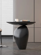 Black cobblestone wooden small side table with sleek curved design and matte finish ideal for compact size living room