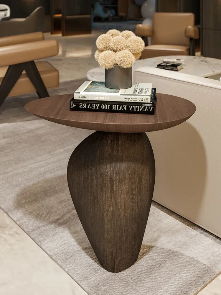 Dark wood oval side table with sleek tapered base and smooth surface ideal for minimalist modern living room compact size
