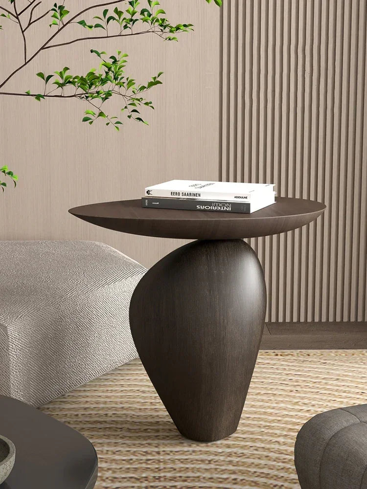 Dark brown sleekly finished compact size wooden side table with smooth rounded top for minimalist modern living room