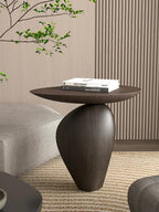 Dark brown sleekly finished compact size wooden side table with smooth rounded top for minimalist modern living room