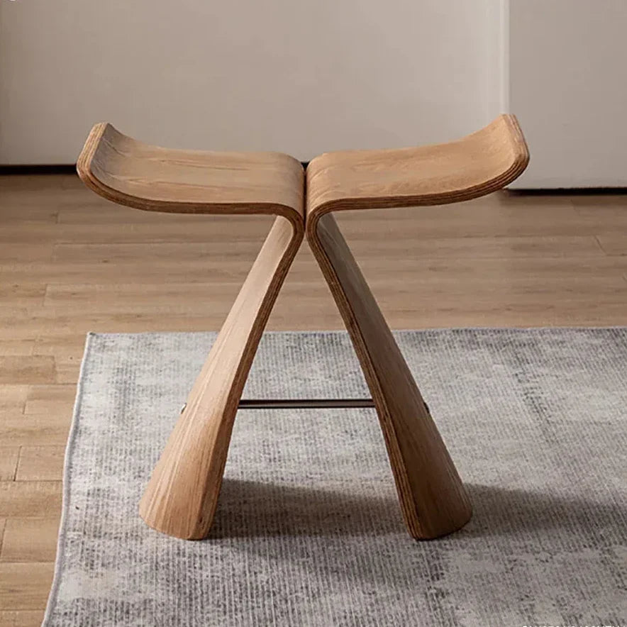 Minimalist small stool ottoman in light oak solid wood with sleek curved legs for apartment living spaces storage