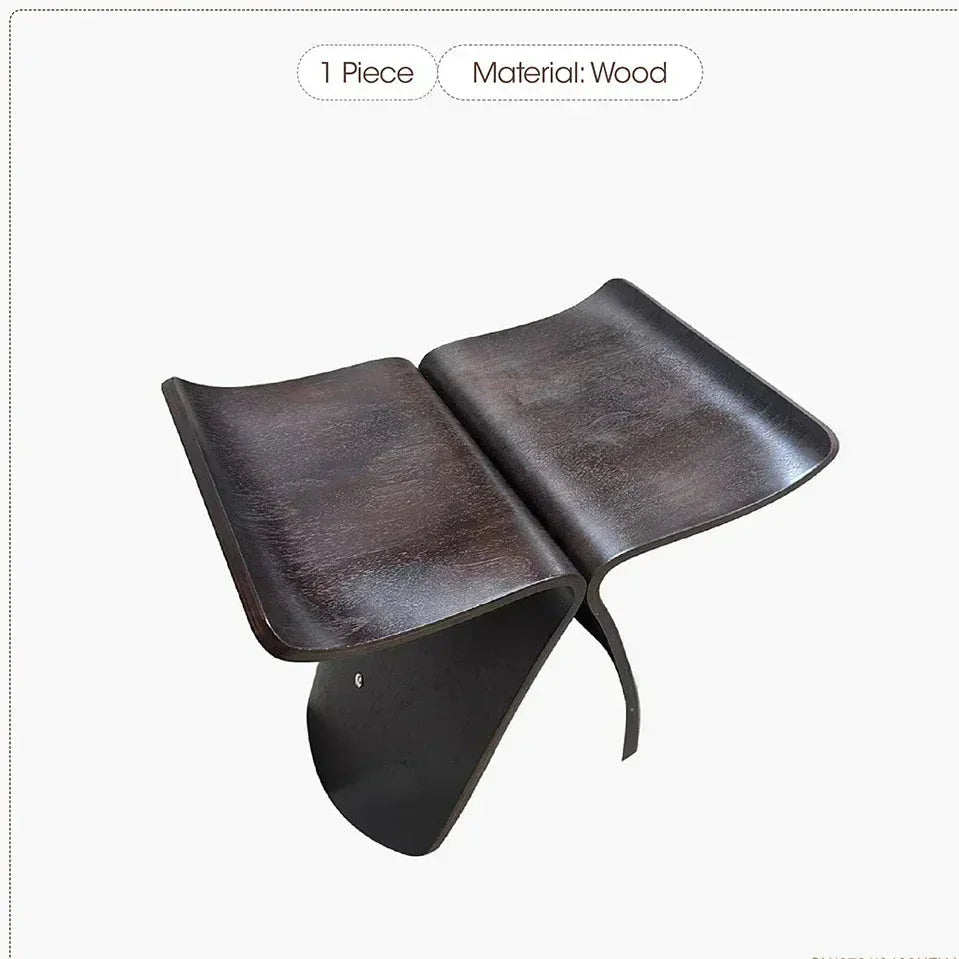 Dark brown solid wood small stool ottoman with sleek curved design and polished surfaces for apartment living spaces