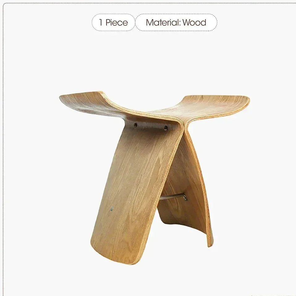 Minimalist small stool ottoman with sleek curved design and smooth light solid wood finish for apartment living spaces